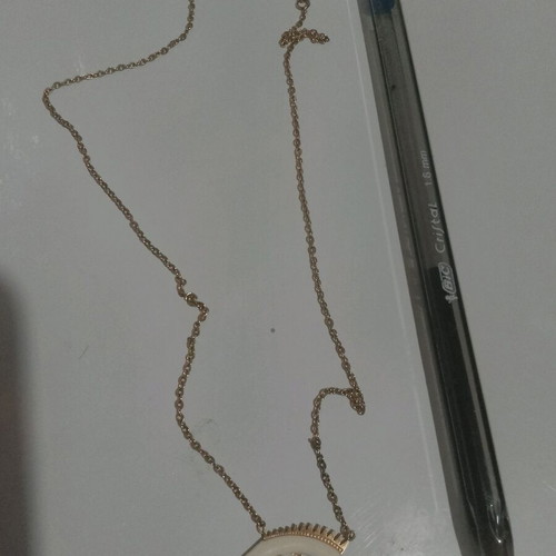 Thin gold-colored necklace used
