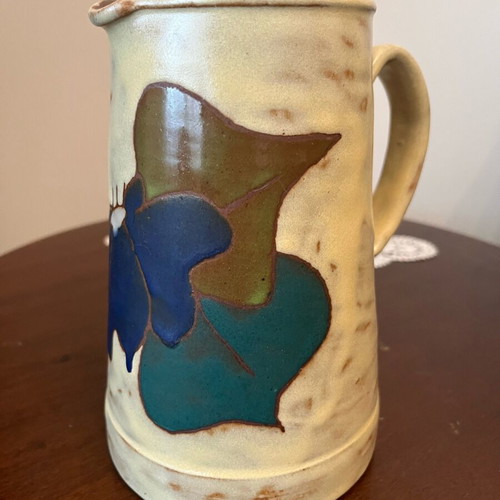 Handmade earthenware jug new with embossed floral pattern