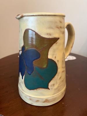 Handmade earthenware jug new with embossed floral pattern