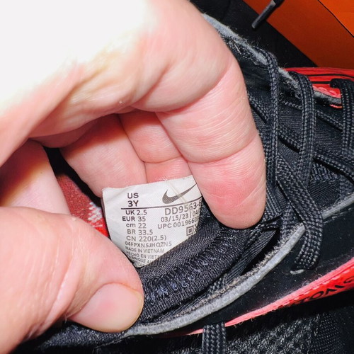 Nike football shoes like new, sizes 22 and 35, black and red