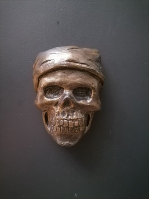 Handmade magnet from white cement with acrylics and metallic spray