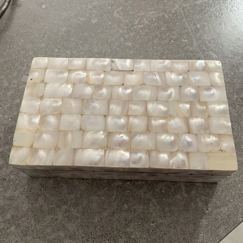 Box with glossy beige-white texture