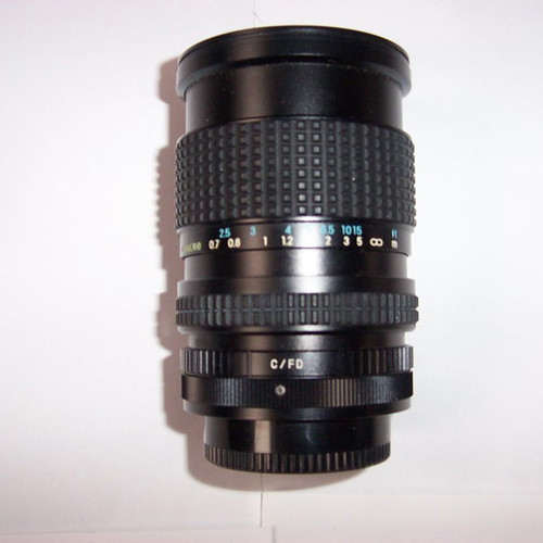 Canon T50 SLR analog camera used with two zoom lenses and flash