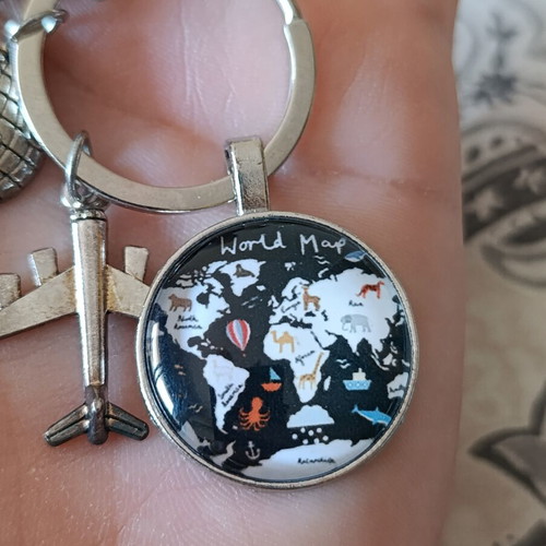 Travel keychain with world map design