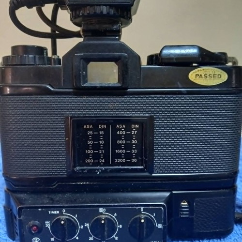Revueflex AC2 35mm SLR film camera used with Sunpak Auto 26 DX flash