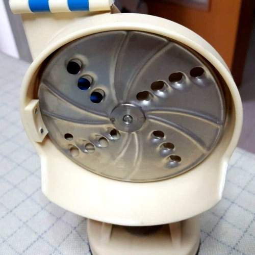 Vintage vegetable cutter used with 4 replacements and suction cup