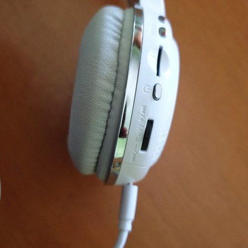 Bluetooth headphones used, white with MP3 and memory card options