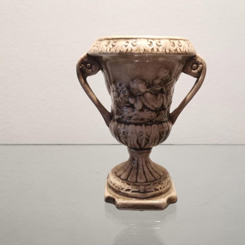Faience amphora used with embossed design and cupids