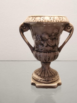 Faience amphora used with embossed design and cupids