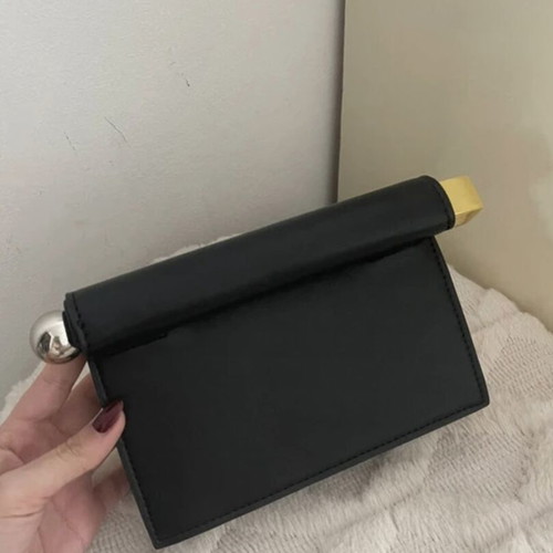 Minimal black handbag with unique closure like new
