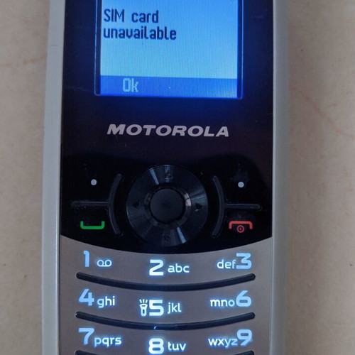 Motorola W180 mobile phone used with keyboard and FM radio