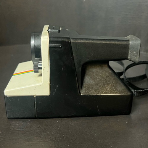 Vintage Polaroid One Step SX-70 camera and film used, white with rainbow stripe