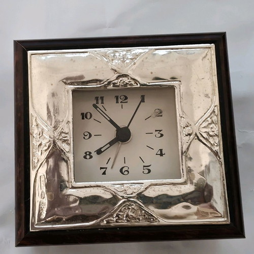 Silver table clock used with wooden frame