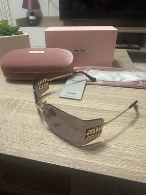 Miu Miu women's sunglasses like new with gold metal frame and purple lenses MU54YS 5AK06I