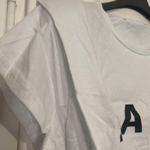 Crop top white with black print, shoulder pads and pleats, new