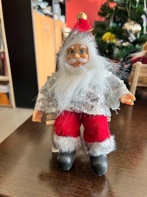 Santa Claus seated on wooden stool new