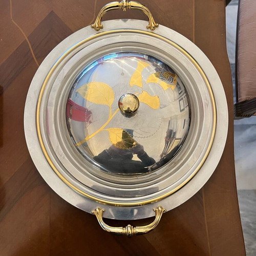 Serving dish made of steel with gold details like new