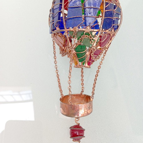 Handmade hot air balloon pendant with copper and glass used