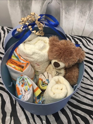 Gift basket like new with sheets, towels and Arktouros teddy bear