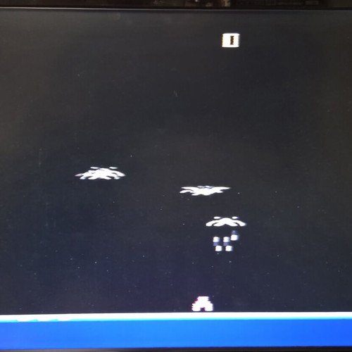 Atari 2600 VCS Woody console used with two joysticks and Demon Attack game