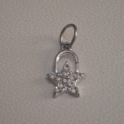 Charm star decorated with sparkling stones used, silver