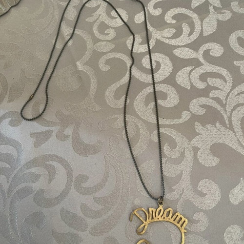 Dream necklace used with gray chain and gold pendant