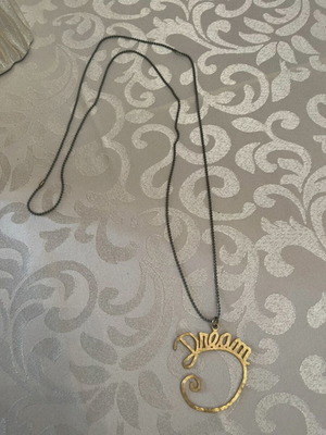Dream necklace used with gray chain and gold pendant