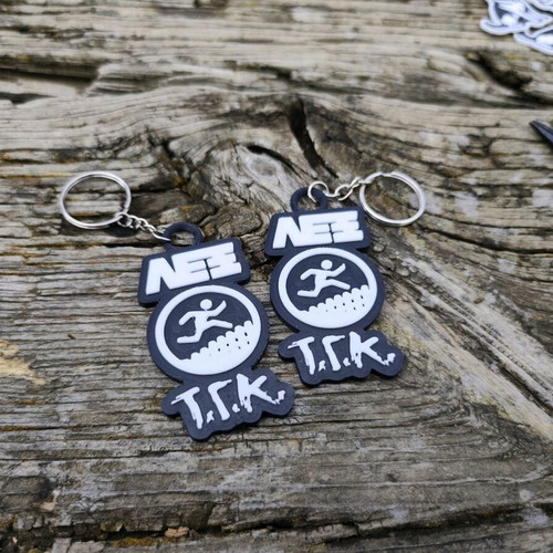 Set of 2 Lex T.G.K. keychains new with embossed design