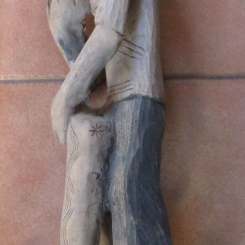 Wooden carved figure used from Colombia with traditional Pan flute