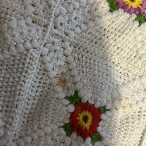 Handmade blanket used with floral crochet design