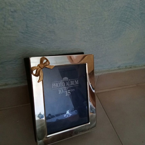 Silver plated photo album frame 10x15 like new with gold bow