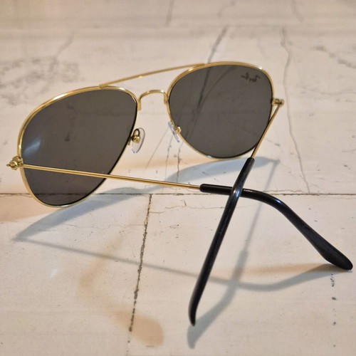 Ray Ban Aviator sunglasses used, gold frame, black temples, gray lenses