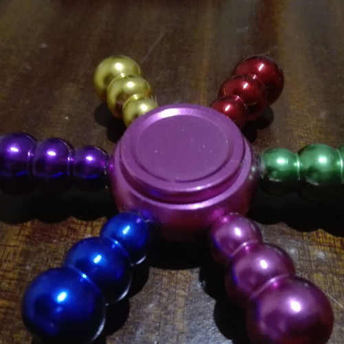 Metal fidget spinner ship wheel like new, rainbow colors