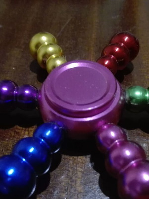 Metal fidget spinner ship wheel like new, rainbow colors
