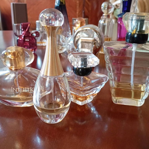 Set of 48 women's perfume bottles, empty and partially filled