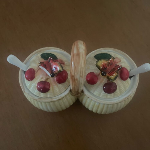 Ceramic jam pots used with spoons and decorative butterfly