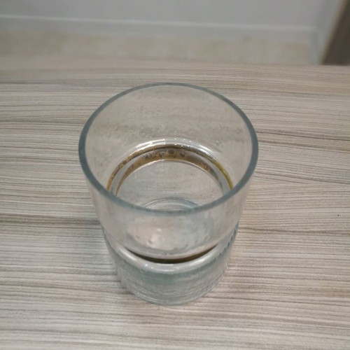Decorative glass candle holder vase used with gold design