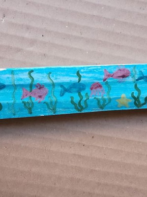 Ceramic incense stick holder used with painted fish design