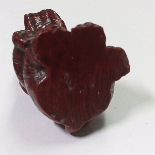 Carved miniature laughing elephant statue like new, burgundy color