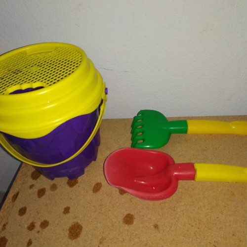 Sand bucket used with shovel, rake and 4 toy cars
