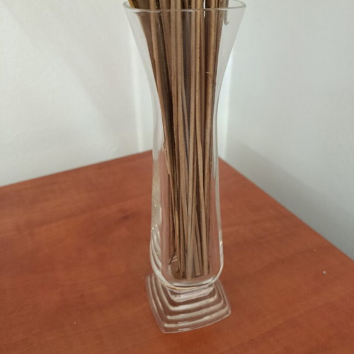 Vase with floral arrangement, pink base