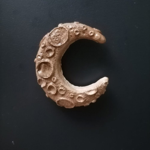 Handmade magnet from white cement, acrylics and varnish