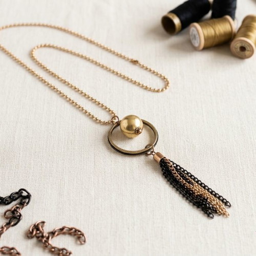 Long statement necklace like new, black and gold tassel pendant