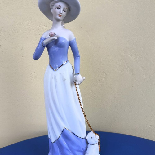 Vintage figurine of aristocratic lady with dog porcelain like new