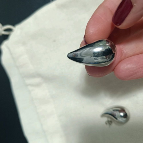 Earrings tear-shaped like new, silver color