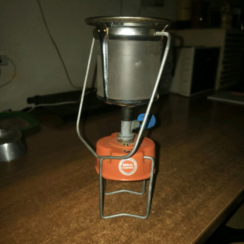 Camping gas lamp used with its protective cage