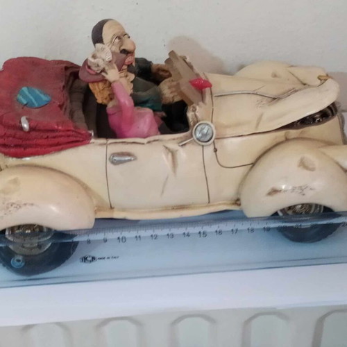 Ceramic funny money box, 25 cm length, funny couple in car, like new