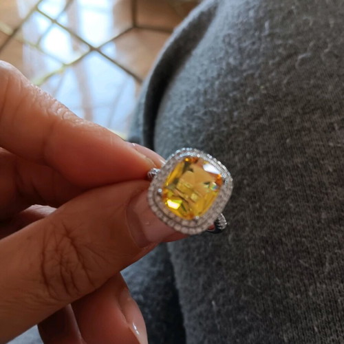 Ring new with large central yellow zircon and white zircons