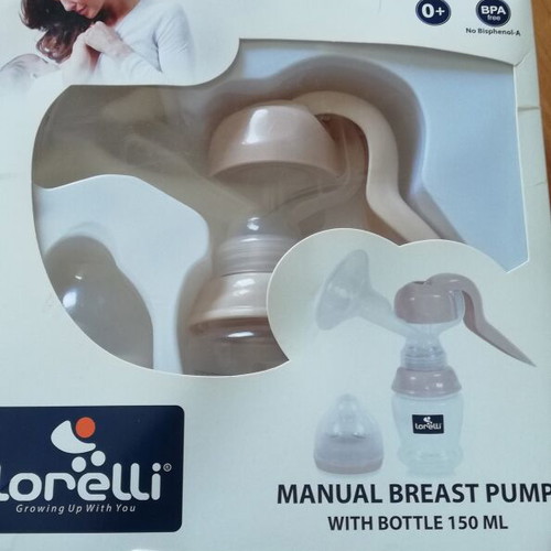Manual breast pump new with nipple and bottle