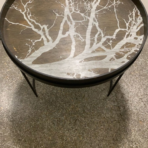 Decorative coffee table used with metal base and wooden top frame